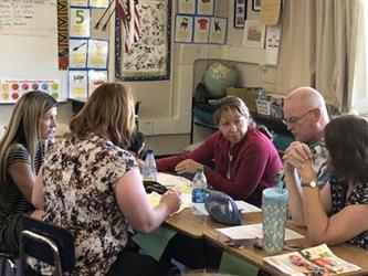 teachers inside having a meeting