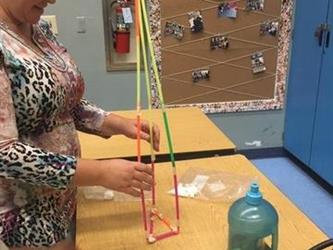 parent doing an activity at a table