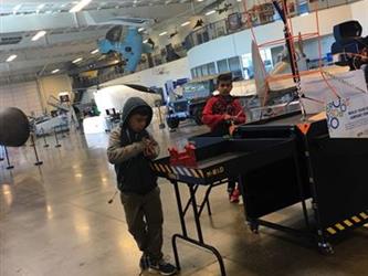 students doing an activity in a space museum