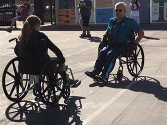 students outside in wheelchairs