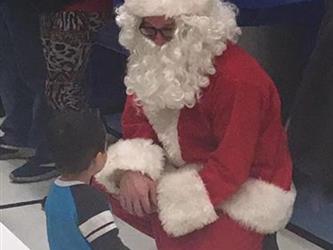 boy talking to santa