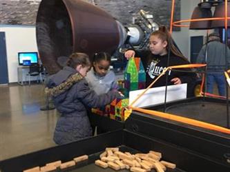 students doing an activity in a space museum