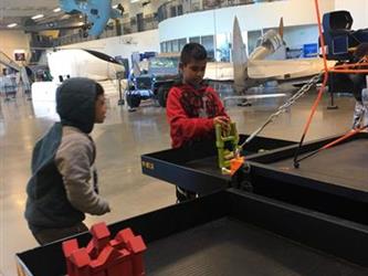 students doing an activity in a space museum