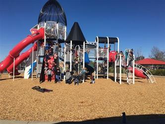 students outside on a play structure