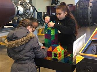 students doing an activity in a space museum