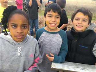 students smiling outside