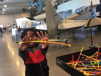 student doing an activity in a space museum