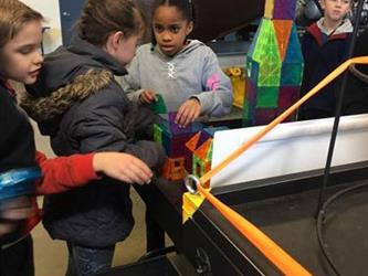 students doing an activity in a space museum