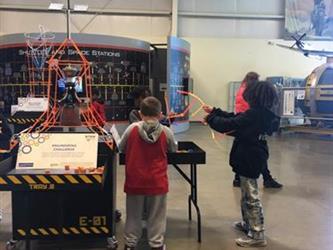 students doing an activity in a space museum