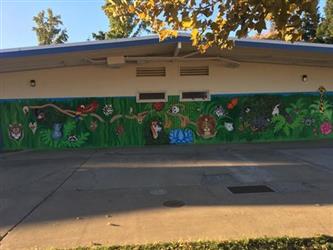 school mural on outside wall