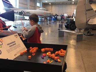 boy doing an activity in a space museum