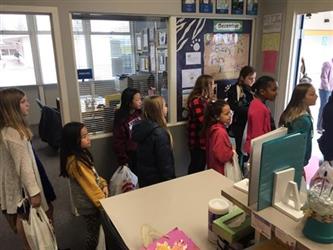 students standing in line in an office