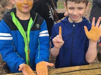 students working with wood outside