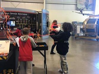 students doing an activity in a space museum