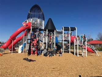 students outside on a play structure